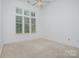 Bright bedroom featuring a large window and neutral decor, offering a cozy retreat at 2810 Selwyn Ave # 410, Charlotte, NC 28209