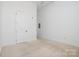 Minimalist bedroom with a ceiling fan and carpet, offering a quiet space to unwind at 2810 Selwyn Ave # 410, Charlotte, NC 28209