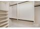 An organized closet space with shelving and rods, offering ample storage solutions at 2810 Selwyn Ave # 410, Charlotte, NC 28209