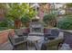 Charming courtyard with an outdoor fireplace and comfortable seating arrangement at 2810 Selwyn Ave # 410, Charlotte, NC 28209