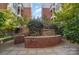 Serene courtyard with lush greenery, stone accents, and a tranquil ambiance at 2810 Selwyn Ave # 410, Charlotte, NC 28209