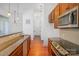 Functional kitchen featuring granite countertops, stainless steel appliances, and modern pendant lighting at 2810 Selwyn Ave # 410, Charlotte, NC 28209