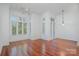 Spacious living room bathed in natural light, showcasing hardwood floors and elegant crown molding at 2810 Selwyn Ave # 410, Charlotte, NC 28209