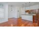 A modern living space with an open floor plan, hardwood floors, and a view of the kitchen at 2810 Selwyn Ave # 410, Charlotte, NC 28209