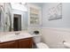 Well-lit bathroom with a sink, toilet, and decorative accents at 3004 Point Clear Dr, Tega Cay, SC 29708