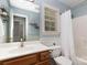 Bathroom with large mirror, neutral paint, shower and tub combination, and natural light at 3004 Point Clear Dr, Tega Cay, SC 29708