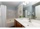 Well-lit bathroom featuring a bathtub and sink with a large mirror at 3004 Point Clear Dr, Tega Cay, SC 29708