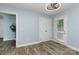 Charming bedroom with wood-look floors, natural light, and neutral wall color at 3004 Point Clear Dr, Tega Cay, SC 29708