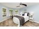 Bright bedroom with large windows, ceiling fan, and stylish decor at 3004 Point Clear Dr, Tega Cay, SC 29708