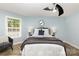 Light and airy bedroom with a ceiling fan and cozy furnishings at 3004 Point Clear Dr, Tega Cay, SC 29708