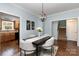 Cozy dining area adjacent to kitchen featuring hardwood floors and natural light at 3004 Point Clear Dr, Tega Cay, SC 29708