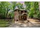Unique home with inviting front porch, a mix of wood and vinyl siding, and natural surroundings at 3004 Point Clear Dr, Tega Cay, SC 29708