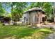 Beautiful home with spacious yard, creek bed, and backyard firepit area at 3004 Point Clear Dr, Tega Cay, SC 29708