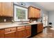 Well-lit kitchen with wooden cabinets, modern appliances, and stylish backsplash at 3004 Point Clear Dr, Tega Cay, SC 29708