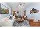 Inviting living room flowing into dining area, featuring hardwood floors and stylish decor at 3004 Point Clear Dr, Tega Cay, SC 29708