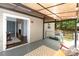Spacious outdoor patio with lighting, seating, and views of the home's backyard at 3004 Point Clear Dr, Tega Cay, SC 29708