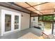 Spacious outdoor patio with lighting, seating, and views of the backyard at 3004 Point Clear Dr, Tega Cay, SC 29708