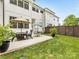 Well-maintained backyard featuring a patio with an outdoor seating area and a privacy fence at 3505 Trent St, Charlotte, NC 28209