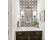 Powder room with stylish vanity, mirror, and patterned tile accent wall at 3505 Trent St, Charlotte, NC 28209