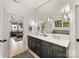 Beautiful bathroom featuring double vanity, modern light fixtures, and stylish decorative mirror at 3505 Trent St, Charlotte, NC 28209