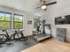 Bright room featuring exercise equipment, hardwood floors, and natural light at 3505 Trent St, Charlotte, NC 28209