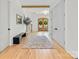 Spacious foyer features double doors, a bench, coat closet, stairs, and natural light at 3505 Trent St, Charlotte, NC 28209
