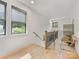 Upstairs hallway featuring hardwood floors and natural light at 3505 Trent St, Charlotte, NC 28209