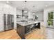 Spacious kitchen with stainless steel appliances, large island, and modern lighting fixtures at 3505 Trent St, Charlotte, NC 28209