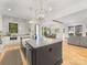 Open concept kitchen with center island and seamless flow to dining and living areas at 3505 Trent St, Charlotte, NC 28209