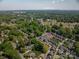 Aerial shot of neighborhood townhomes nestled among lush greenery, highlighting community layout at 413 Nobles Way, Belmont, NC 28012