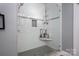 Modern bathroom shower with a glass door and a tiled shower with a built-in shelf at 413 Nobles Way, Belmont, NC 28012