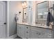 Bathroom featuring dual sinks, granite countertops, and storage space at 413 Nobles Way, Belmont, NC 28012