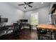 Bedroom features a gray wall paint, dark hardwood floor and two computer setups for multiple users at 413 Nobles Way, Belmont, NC 28012