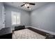 Bedroom with white trim and a decorative rug, perfect for a cozy atmosphere at 413 Nobles Way, Belmont, NC 28012