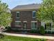 Charming brick home featuring manicured landscaping, sidewalk, and inviting curb appeal at 413 Nobles Way, Belmont, NC 28012