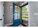 Open front door with blue trim and a view of the landscaped front yard at 413 Nobles Way, Belmont, NC 28012