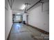 Clean garage featuring brick trim, plenty of space for storage, and convenient access at 413 Nobles Way, Belmont, NC 28012