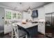 Bright kitchen with granite counters, stainless steel appliances, and kitchen island at 413 Nobles Way, Belmont, NC 28012