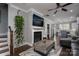 Spacious living room showcasing hardwood floors, a fireplace, and seamless access to an adjacent room at 413 Nobles Way, Belmont, NC 28012