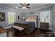 Well-lit main bedroom featuring hardwood floors and complemented by stylish decor and furnishings at 413 Nobles Way, Belmont, NC 28012