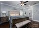 Main bedroom with hardwood floors, a ceiling fan, and a luxurious bathroom with a glass-enclosed shower at 413 Nobles Way, Belmont, NC 28012
