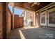 Covered brick patio with a ceiling fan, perfect for outdoor enjoyment and entertaining at 413 Nobles Way, Belmont, NC 28012