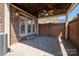 Covered brick patio with ceiling fan, offering an ideal outdoor living space at 413 Nobles Way, Belmont, NC 28012