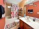 Bright bathroom with colorful decor, vanity, and shower/tub combination at 4825 Samuel Richard St, Kannapolis, NC 28083