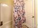 Bathroom area featuring a tub/shower with butterfly-themed shower curtain at 4825 Samuel Richard St, Kannapolis, NC 28083