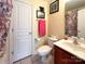 Bathroom with single vanity, tile floor, and butterfly-themed shower curtain at 4825 Samuel Richard St, Kannapolis, NC 28083