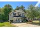Charming two-story home with a welcoming front porch and well-maintained landscaping at 4825 Samuel Richard St, Kannapolis, NC 28083