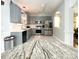 Updated kitchen boasts gray cabinets, stainless steel appliances, and marble countertops at 4825 Samuel Richard St, Kannapolis, NC 28083