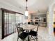 Eat-in kitchen offers gray cabinets, stainless steel appliances, and a view to the fenced yard at 4825 Samuel Richard St, Kannapolis, NC 28083
