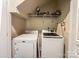 Convenient laundry room with washer, dryer, and shelving for ample storage at 4825 Samuel Richard St, Kannapolis, NC 28083